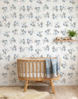 Frost Berry removable wallpaper with blue berries and gray leaves in modern nursery setting