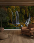 Serene waterfall among vegetation with calming aesthetic removable wall mural