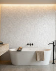 Ghost Fronds pale palm wallpaper creating ambiance in a serene bathroom