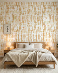 Gilded Brushstroke removable wallpaper with gold geometric pattern on cream background in modern bedroom