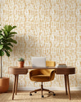 Gilded Brushstroke removable wallpaper in gold and cream tones on modern home office accent wall