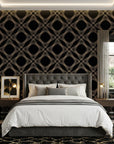 Gilded Cage black and gold geometric diamond trellis wallpaper adding character to a cozy bedroom
