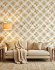 Gilded Shards gold and white geometric chevron tile wallpaper in a warm and inviting living room