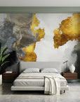 Gilded Thunder gold and charcoal abstract wallpaper in a warm and inviting living room
