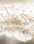 Ethereal Golden Birds wallpaper with flock soaring through soft clouds and misty mountain landscape