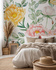 A watercolor-style self-adhesive wall covering featuring a pink and yellow floral motif, named Golden Blush