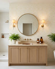 Cream and gold Golden Echo geometric diamond wallpaper in modern spa bathroom with brass fixtures
