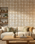 Golden Loom textured plaid wallpaper in warm beige tones on living room accent wall