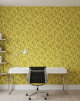 Golden Stitch Garden golden yellow floral wallpaper as a feature wall in a bright home office