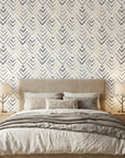 Grey and beige chevron Grey Fret peel and stick wallpaper in modern bedroom with neutral bedding