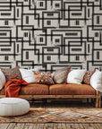 Self-adhesive, removable wallpaper featuring a loosely drawn geometric grid pattern in beige and black