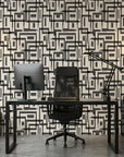 Gridded Scrawl black and beige abstract geometric square wallpaper as a feature wall in a bright home office