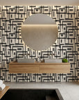 Gridded Scrawl black and beige abstract geometric square wallpaper creating ambiance in a serene bathroom