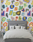 Vibrant ransom-style typography mural featuring mismatched magazine clippings and adhesive backing - Happy Chaos