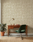 Harvest Loom neutral woven texture wallpaper as a feature wall in a bright home office
