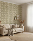 Harvest Sprig warm olive botanical wallpaper in a warm and inviting living room