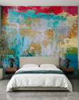 Heat & Tide vibrant red and teal abstract wallpaper in a warm and inviting living room