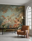 Heavenly Gathering baroque mural wallpaper featuring cherubs and clouds in living room with leather chair
