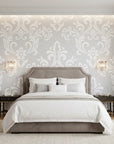 Heirloom Rose Medley soft grey and white damask wallpaper adding character to a cozy bedroom