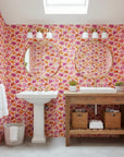 Hibiscus Carnival vibrant pink tropical wallpaper creating ambiance in a serene bathroom