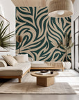 Self-adhesive wall covering featuring an abstract, swirling pattern in green and beige, named 'Hidden Rivers'