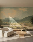 Highland River Valley mural wallpaper showing painted landscape with mountains, river valley, and soft sage green tones
