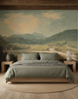 Sage green Highland River Valley landscape mural wallpaper on rustic bedroom accent wall with wooden beams