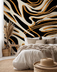Self-adhesive wallcovering featuring an abstract black, white, and gold marble pattern, titled Honeyed Strata