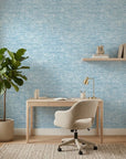 Indigo Current serene blue abstract wallpaper as a feature wall in a bright home office