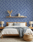 Navy and slate blue Indigo Labyrinth geometric wallpaper on modern bedroom accent wall