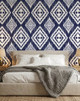 Indigo Shibori hand-dyed look wallpaper adding character to a cozy bedroom