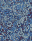 Peel and stick Indigo Static wallpaper featuring a heavily textured blue and purple abstract grunge design