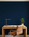 Indigo Undertow deep navy blue swirling abstract wallpaper adding character to a cozy bedroom