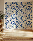 Simple blue foliage pattern on a cream background peel and stick wallpaper