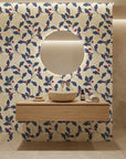 Ink & Oak navy and red botanical wallpaper creating ambiance in a serene bathroom