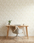Ivory Promenade elegant gold art deco arch wallpaper adding character to a cozy bedroom