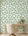 Jade & Citron botanical wallpaper with green eucalyptus leaves on cream background in modern home office