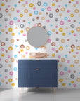 A playful array of rainbow-colored paw prints on a peel-and-stick decorative wall mural - Joyful Jaunts