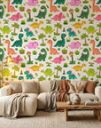 Jurassic Bloom green botanical dinosaur wallpaper as a feature wall in a bright home office