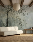 Sage green Last Leaves botanical wallpaper with delicate branch motifs in modern living room