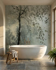 Sage green and cream Last Leaves botanical wallpaper behind freestanding tub in serene spa bathroom