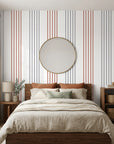 Rust and gray striped Lavender Stripe peel and stick wallpaper in modern coastal bedroom setting