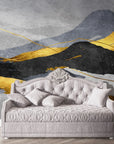 Gray and gold Layered Mountains peel and stick wallpaper behind ornate tufted daybed in elegant bedroom