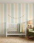 Leaf Stripe removable wallpaper in sage green and mustard yellow stripes on nursery accent wall