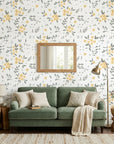 Lemon Grove removable wallpaper with yellow flowers and gray leaves on living room accent wall