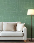 Green and white crosshatch patterned self-adhesive wallpaper in a mid-century style