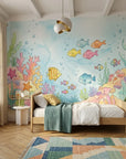 Whimsical underwater scene Little Blue World wallpaper with colorful fish, coral, and seaweed in a child's bedroom