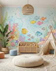 Little Blue World underwater scene wallpaper in child's playroom with coral, fish, and seaweed motifs