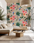 Peach-toned wall covering depicting exotic parrots, palm leaves, and hibiscus blooms. - Lush Notion