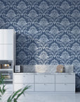 Navy and slate blue damask wallpaper with ornate baroque motifs in modern kitchen setting